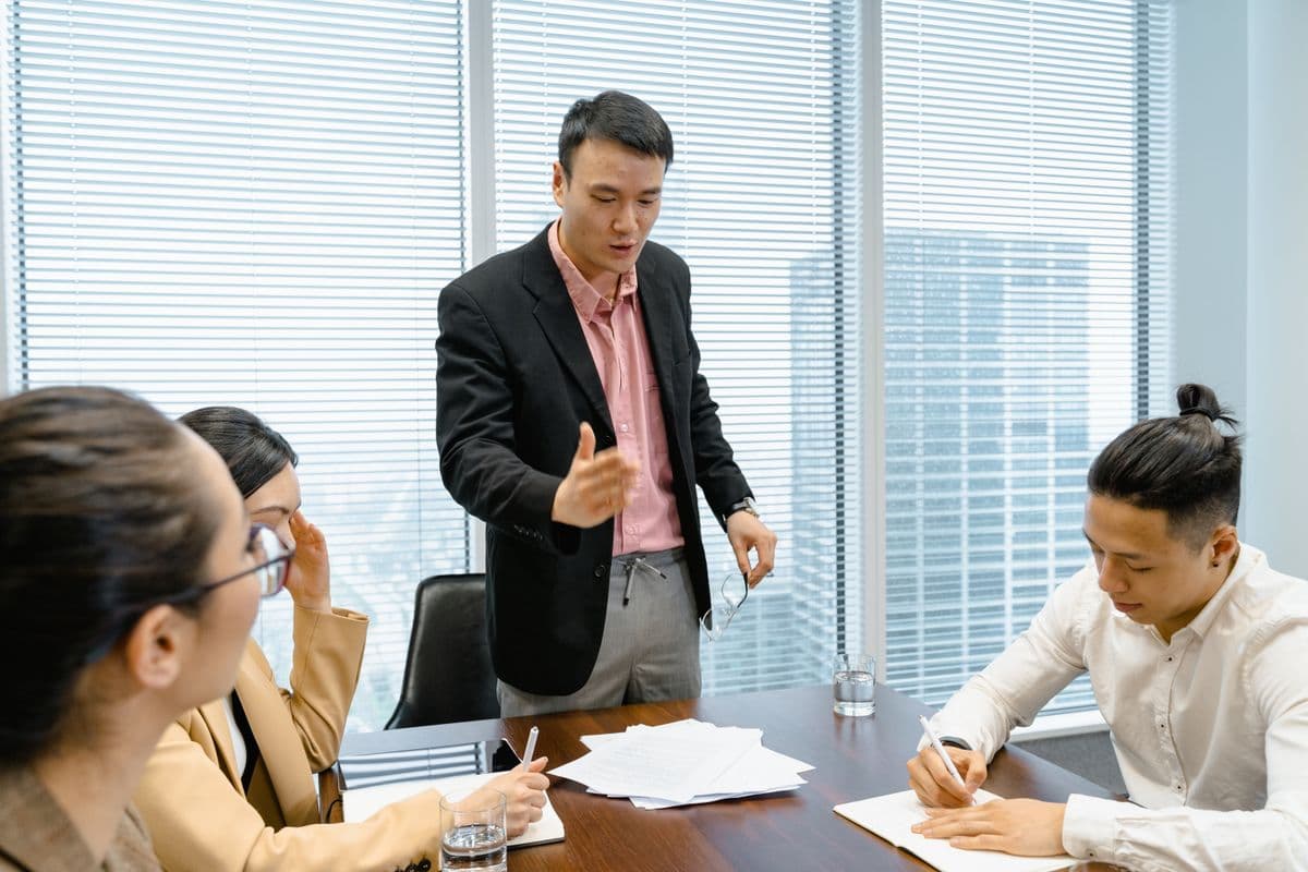 Adhika Infotech consultants reviewing a technology solution together