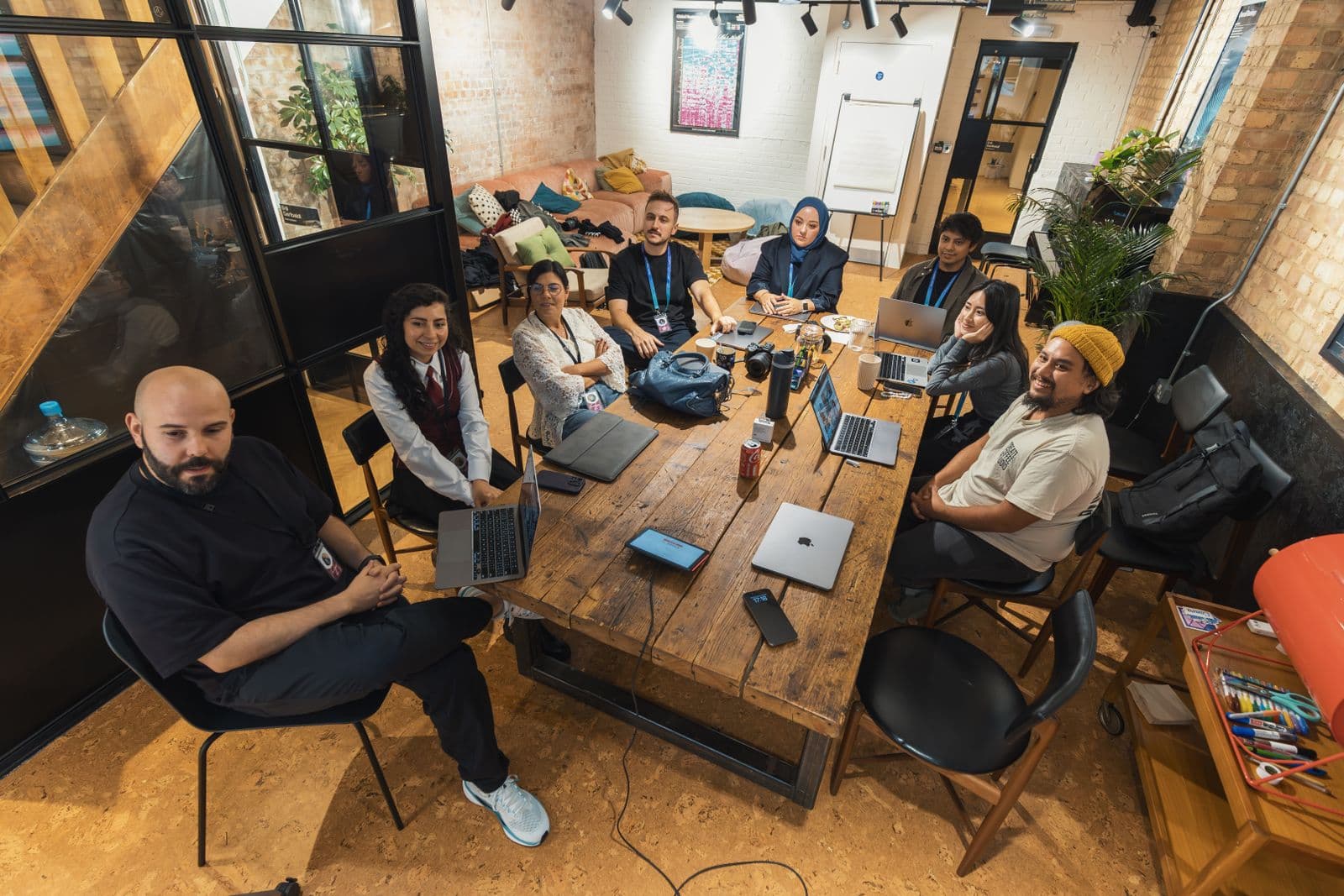 Adhika Infotech team collaborating in a modern office
